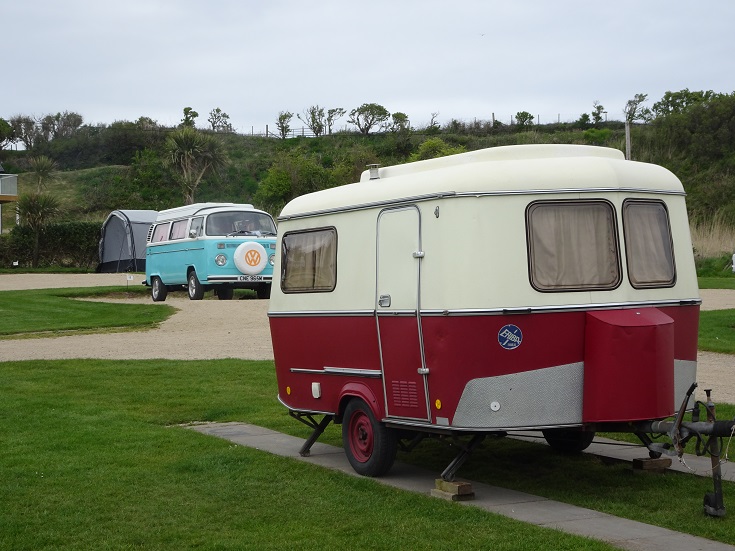 Campsite at seal shore Arran with old campervan and caravan