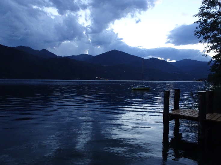 The view of lake orta at dusk from the banks of Pettenasco