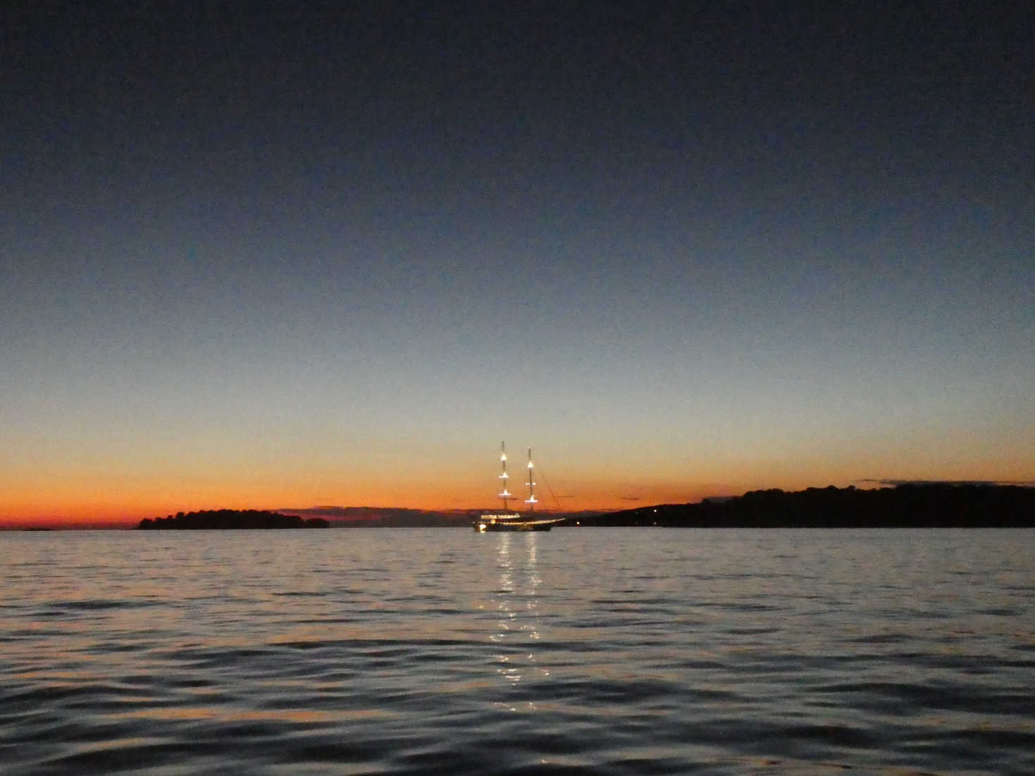 boat in the bay at dusk Rovinj