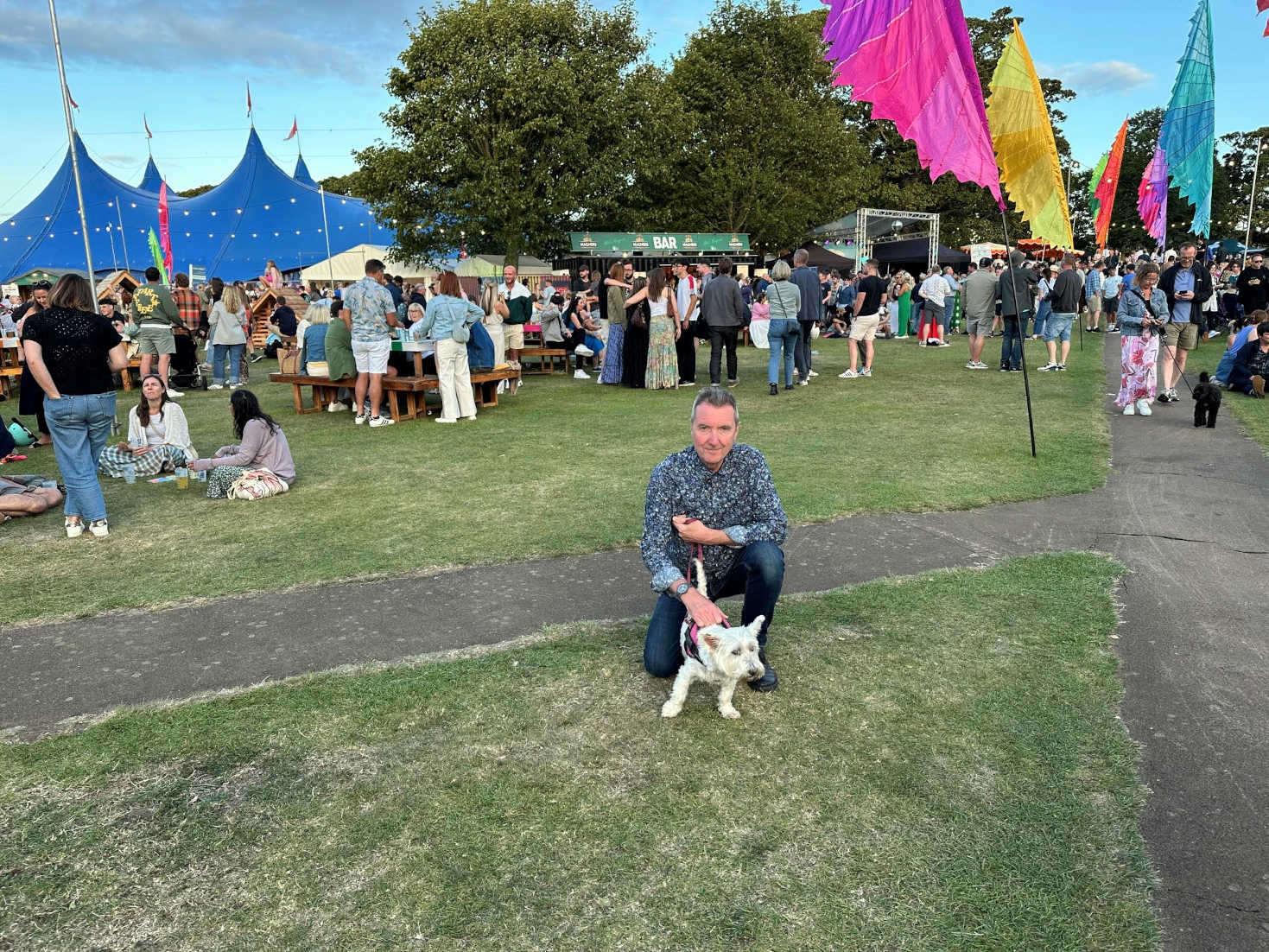 poppy the westie and dad at the concert